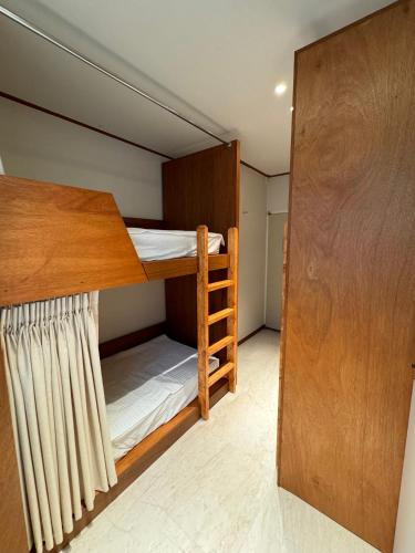 a small room with a bunk bed in it at DADU House in Seoul