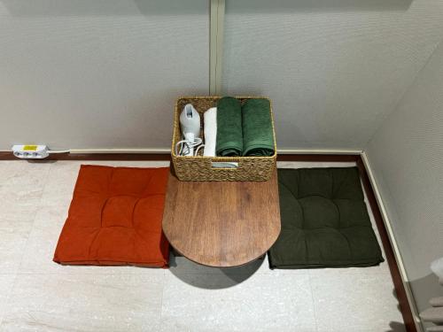 a basket sitting on the floor in a room at DADU House in Seoul