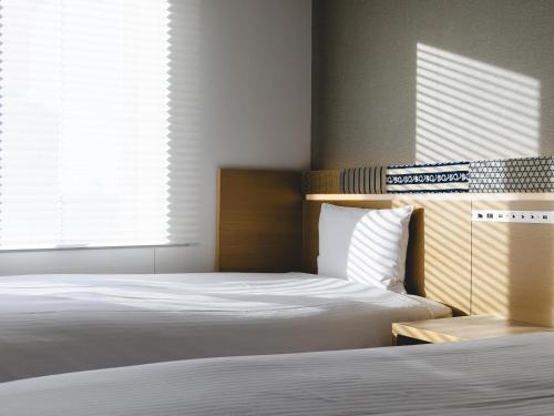 Katil atau katil-katil dalam bilik di Hotel Gracery Asakusa