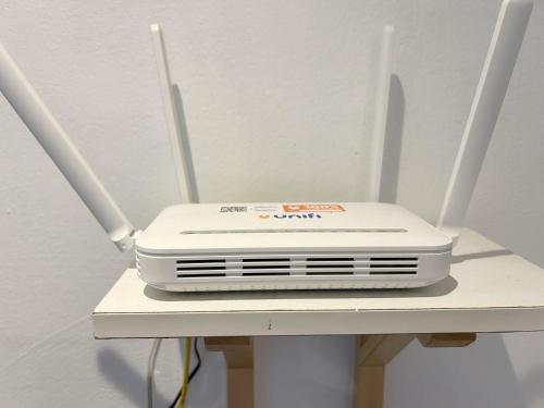 a white appliance sitting on top of a chair at BF Stay 2 in Kuala Terengganu