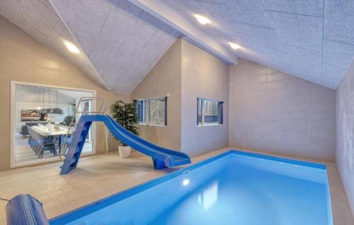 a indoor swimming pool with a slide in a house at Stunning Home In Jesendorf With Sauna in Jesendorf