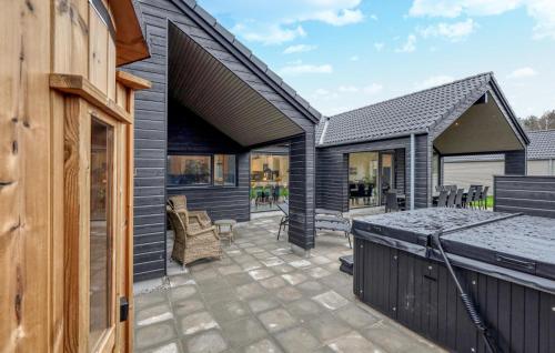 a patio of a home with a house at Lovely Home In Jesendorf With Sauna in Jesendorf