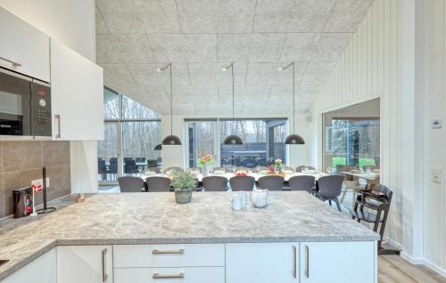 a kitchen and dining room with a table and chairs at Lovely Home In Jesendorf With Sauna in Jesendorf