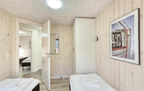a bedroom with two beds and a mirror at Lovely Home In Jesendorf With Sauna in Jesendorf