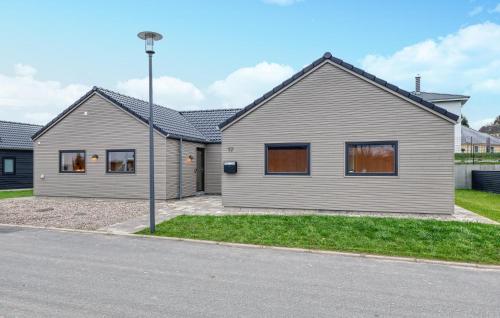 a house on the side of a street at Lovely Home In Jesendorf With Sauna in Jesendorf
