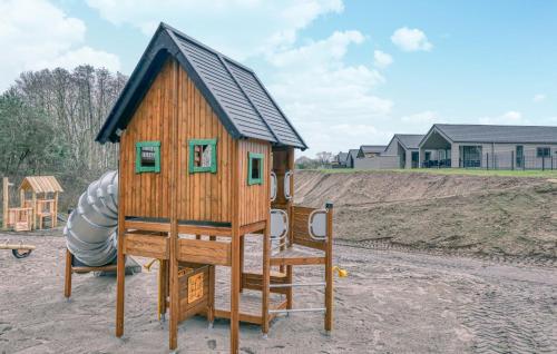 a play structure with a slide on a playground at Lovely Home In Jesendorf With Sauna in Jesendorf