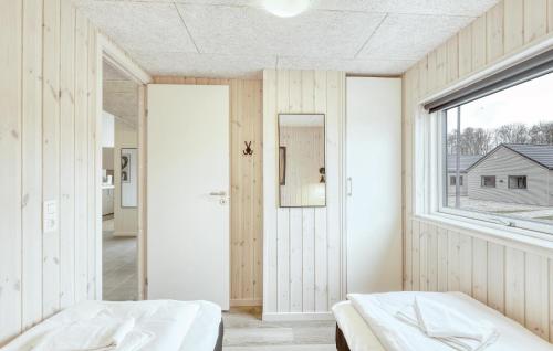 a bedroom with two beds and a window at Lovely Home In Jesendorf With Sauna in Jesendorf