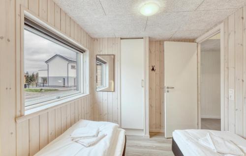 a room with two beds and a window at Lovely Home In Jesendorf With Sauna in Jesendorf