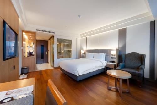 Postel nebo postele na pokoji v ubytování Hotel Interburgo Daegu