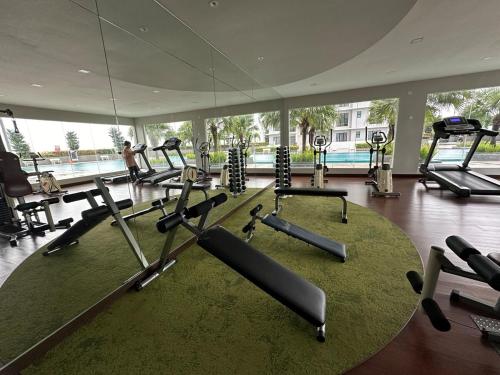a gym with several treadmills and exercise bikes at The Platino 6 to 8pax 2 carpark with Nextflix 5min to Paradigm in Johor Bahru