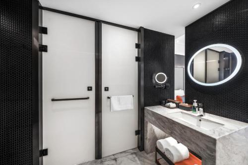 a bathroom with a sink and a mirror at Atour S Hotel Chengdu Taikoo Li in Chengdu