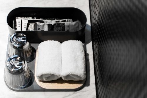 a black box with towels and a salt and pepper at Atour S Hotel Chengdu Taikoo Li in Chengdu