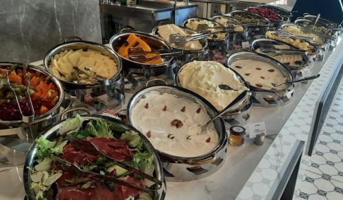 a buffet filled with lots of different types of food at Cappadocia Marriott Hotel in Nevsehir