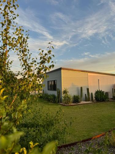 a small house with a garden in front of it at Dreamy Staiz - Riverland Abode in Barmera