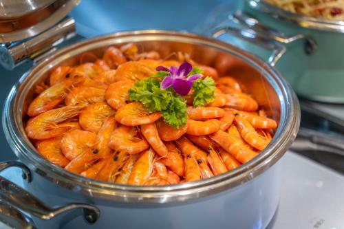 a pot of food with a flower on top of it at Atour S Hotel Chengdu Taikoo Li in Chengdu