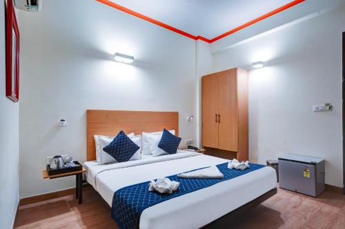 Postel nebo postele na pokoji v ubytování Hotel Noida Express