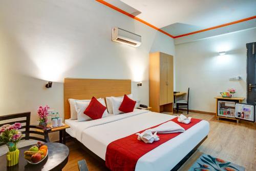 Postel nebo postele na pokoji v ubytování Hotel Noida Express