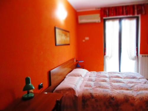 Postel nebo postele na pokoji v ubytování Hotel Rosso Di Sera