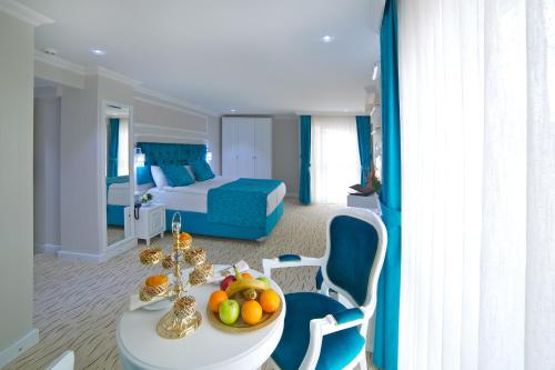 a hotel room with a table with fruit on it at Glamour Hotel Istanbul Sirkeci in Istanbul