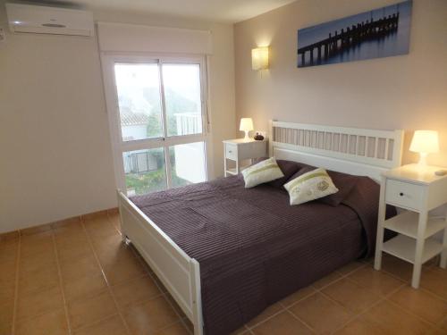 Posteľ alebo postele v izbe v ubytovaní Apartamento Bahia Dorada