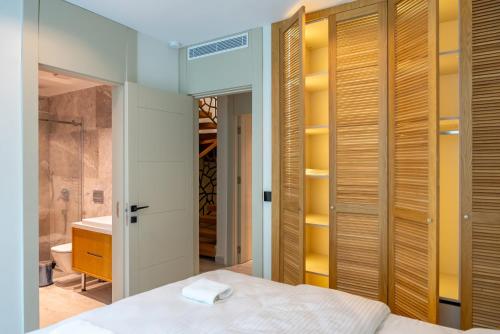 a bedroom with a bed and a bathroom at Villa with Private Swimming Pool in Bodrum in Bodrum City