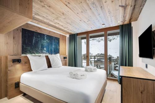 Chalet Hôtel Quartzにあるベッド