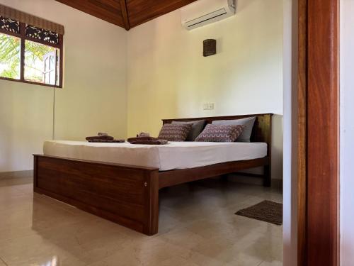 a bedroom with a bed in a room at Czech House in Tangalle
