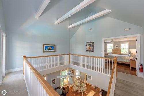 a staircase in a house with a bedroom at Windward Breeze in Key West