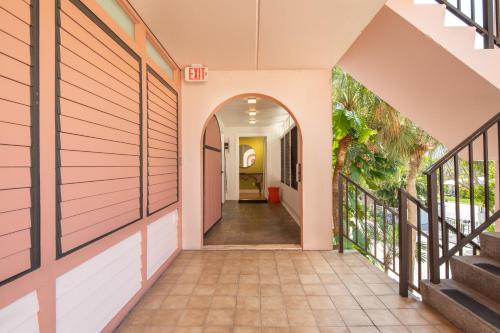 an internal hallway of a house with a hallway leading to a hallway at Beach Club Shangra La 206 in Key West
