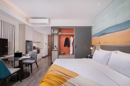 Postel nebo postele na pokoji v ubytování Citadines Bacolod City