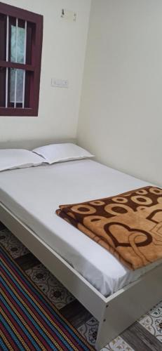 Postel nebo postele na pokoji v ubytování Prakruti Home stay