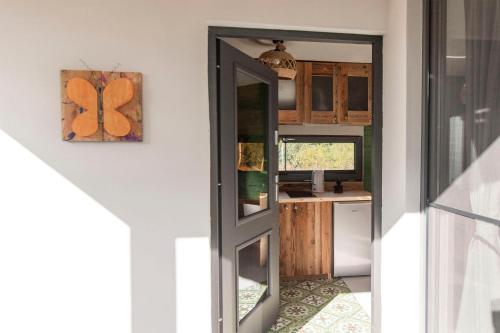 a door leading to a kitchen in a house at SOBIESZEPTY Odetchnij ciszą in Gdańsk
