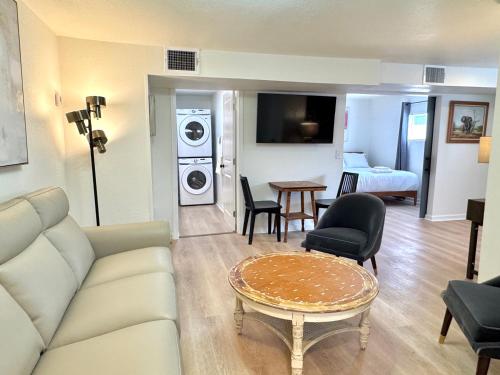 a living room with a couch and a table at 2br Townhouse Taft Stadium & Plaza Dining #n39 in Oklahoma City