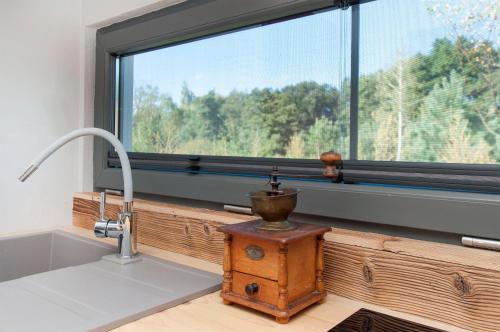 a kitchen with a sink and a window at SOBIESZEPTY Odetchnij ciszą in Gdańsk
