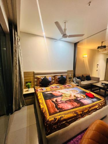 a bedroom with a large bed in a room at The lockwoods Supernova spira in New Delhi