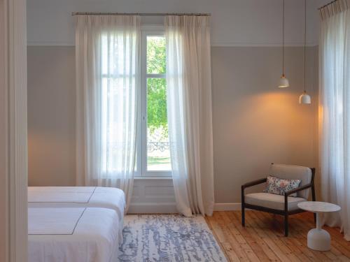 Ένα ή περισσότερα κρεβάτια σε δωμάτιο στο Château Grand Corbin - Bed & Breakfast