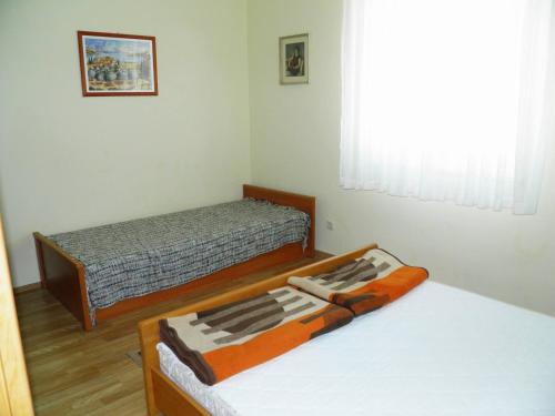 Postel nebo postele na pokoji v ubytování Apartments Klaric