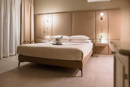 Le Greghe Suitesにあるベッド