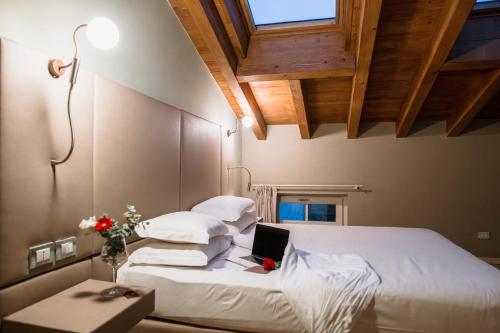 Le Greghe Suitesにあるベッド