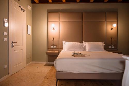Le Greghe Suitesにあるベッド