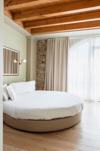 Le Greghe Suitesにあるベッド