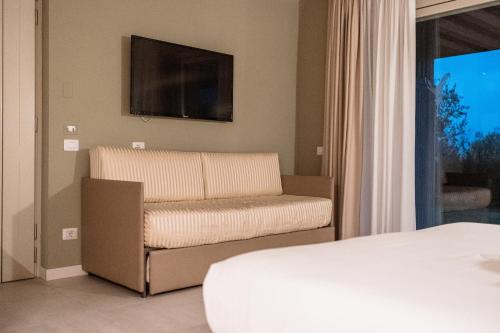 Le Greghe Suitesにあるテレビまたはエンターテインメントセンター