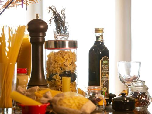 a table with a bottle of wine and a glass at Novotel Jazan in Jazan
