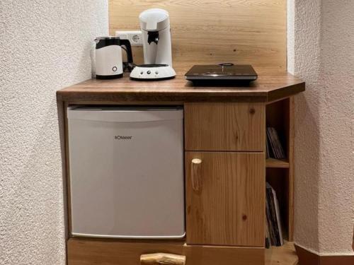 a wooden counter with a small appliance on top of it at Biobetrieb Lippenhof in Breitnau