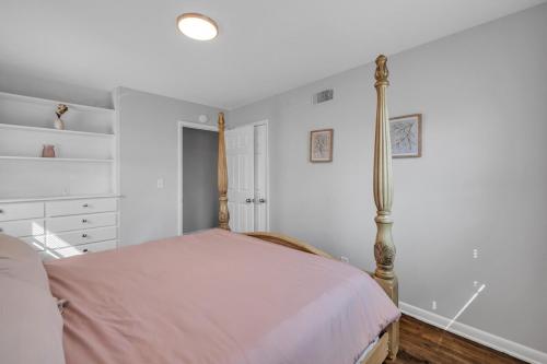 a bedroom with a bed with a pole at EXPO HOME just minutes from downtown Tulsa in Tulsa