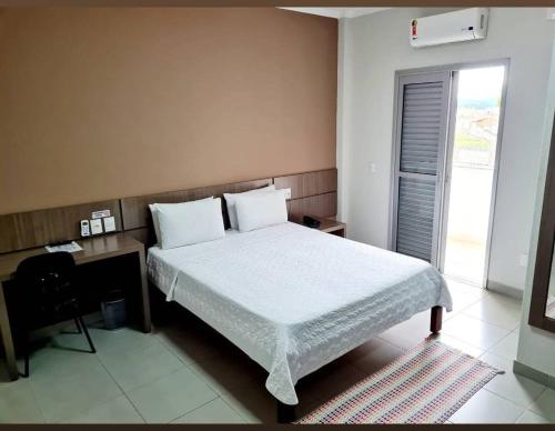 Postel nebo postele na pokoji v ubytování Hotel Mohallem