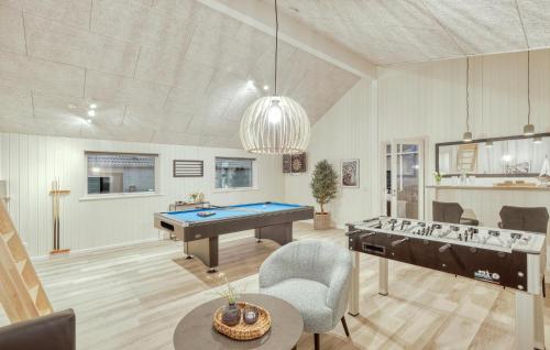 a living room with a pool table and ping pong ball at Cozy Home In Jesendorf With Sauna in Jesendorf