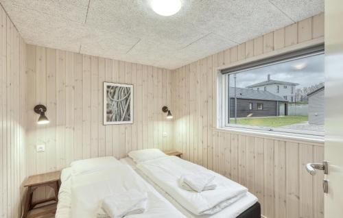 a bedroom with two beds and a window at Cozy Home In Jesendorf With Sauna in Jesendorf
