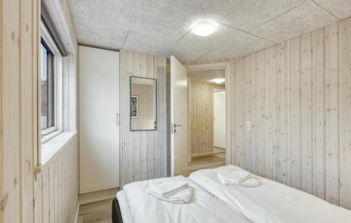 a white room with a bed and a window at Cozy Home In Jesendorf With Sauna in Jesendorf