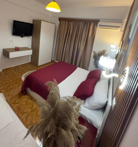 Ένα ή περισσότερα κρεβάτια σε δωμάτιο στο Kingsland Apartment Ksamil